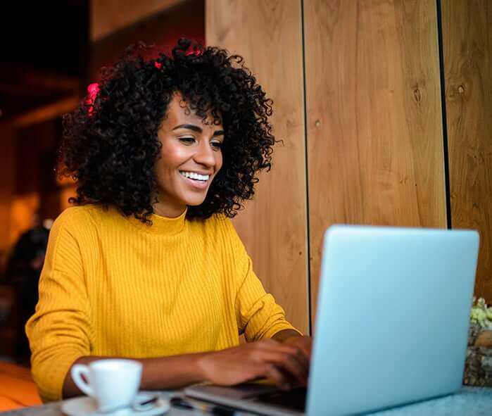 woman looking at her laptop