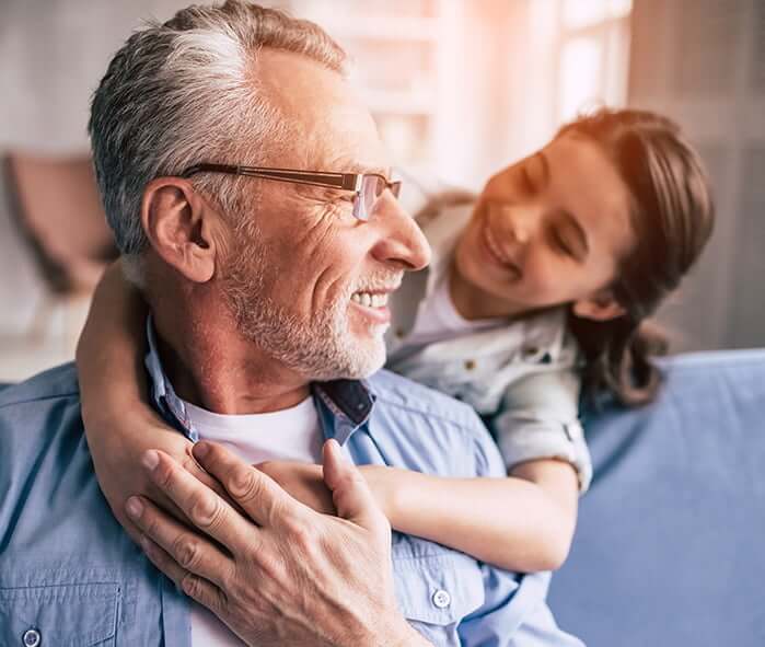 man playing with his granddaughter