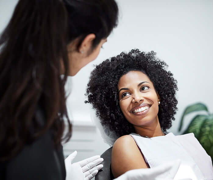 woman talking with her dentist