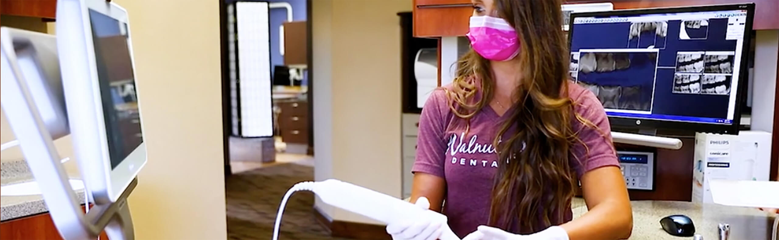 staff member using dental tech