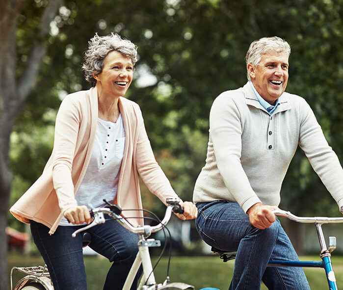 senior couple on bikes