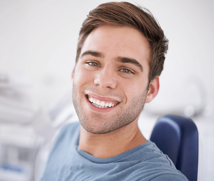 man at dentist smiling