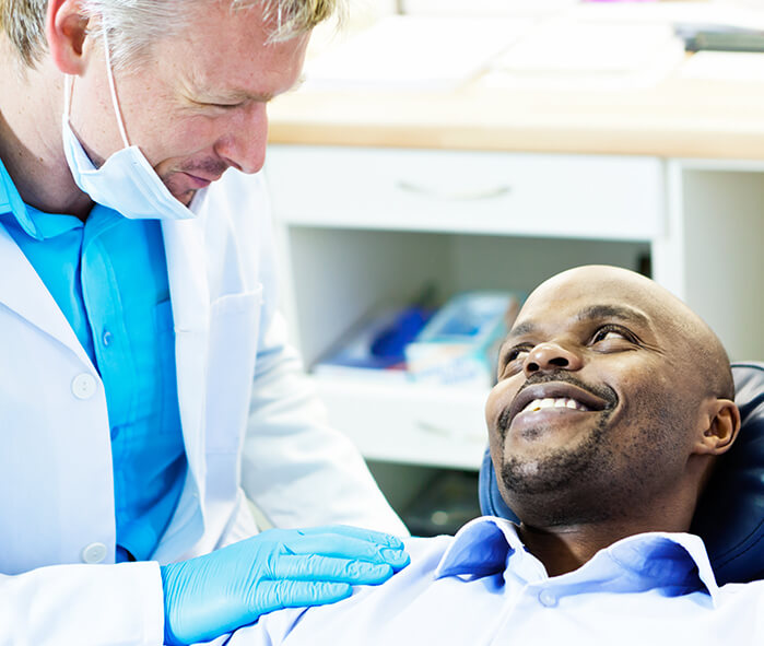 dentist comforting a patient
