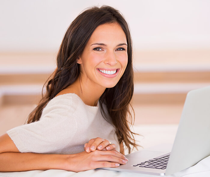 smiling woman with computer