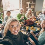group picture during thanksgiving dinner, prep with a holiday smile makeover